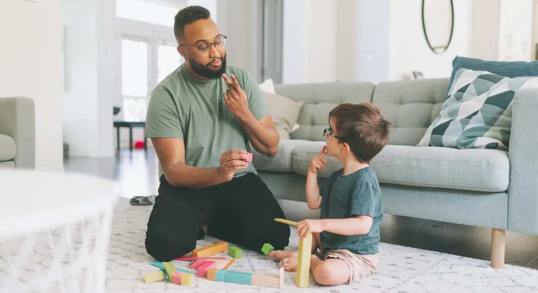teacher helping special child to learn