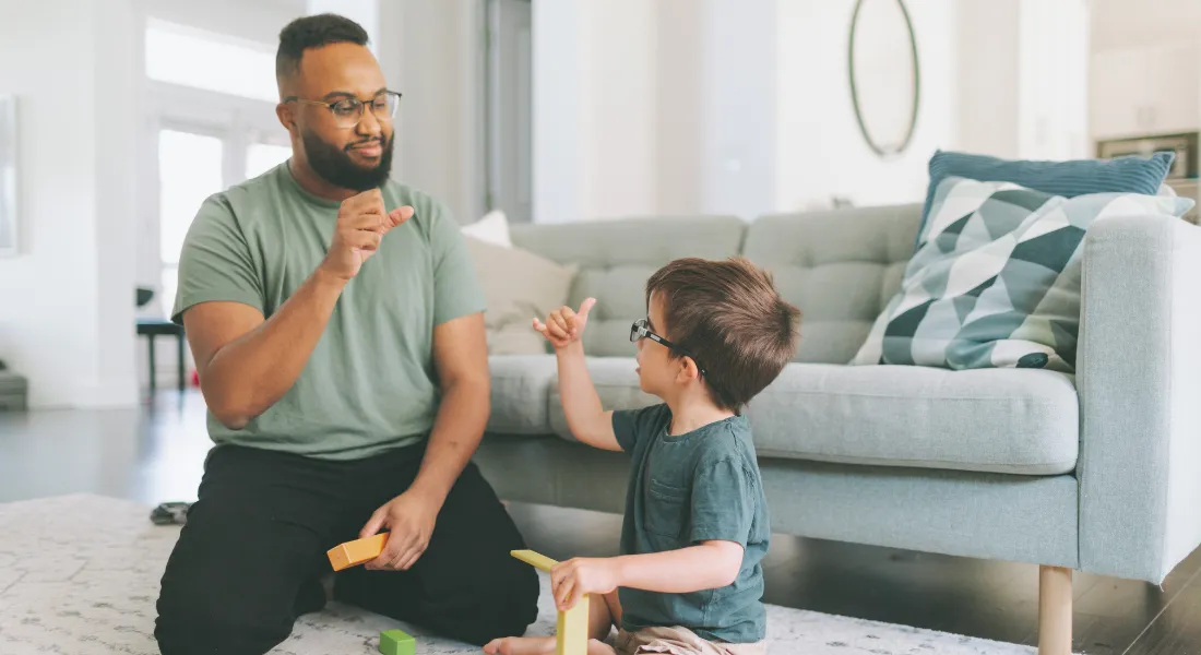 teacher helping special child to learn